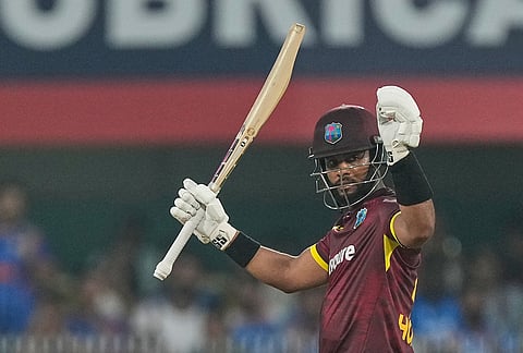 West Indies' captain Shai Hope celebrates his century during the second one-day international cricket match between India and West Indies in Guwahati, India, Wednesday, Sept. 30, 2026.