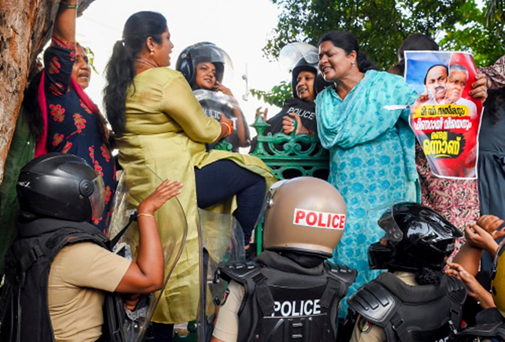 | Photo: PTI : Mahila Morcha activists scuffle with police personnel near the State Secretariat during a protest, in Thiruvananthapuram. The protest was organized in response to Youth Congress workers waving black flags at Union Home Minister Amit Shahs convoy during his visit to Kollam. 