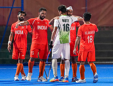 India's captain Harmanpreet Singh, 13, Mandeep Singh, 11, and Manpreet Singh, 7, being congratulated by Pakistan's Ammad Butt, 16, after winning the men's semifinal hockey match between India and Pakistan, at the ongoing 20th Asian Games, in Kakamigahara, Japan, Thursday, Oct. 1, 2026. India's Nilakanta Sharma, 18, is also seen. 