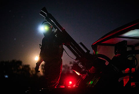 A Ukrainian air defense soldier gets ready to repel Russia's drone attack in Kyiv, Ukraine, Saturday evening, Sept. 19, 2026. 
