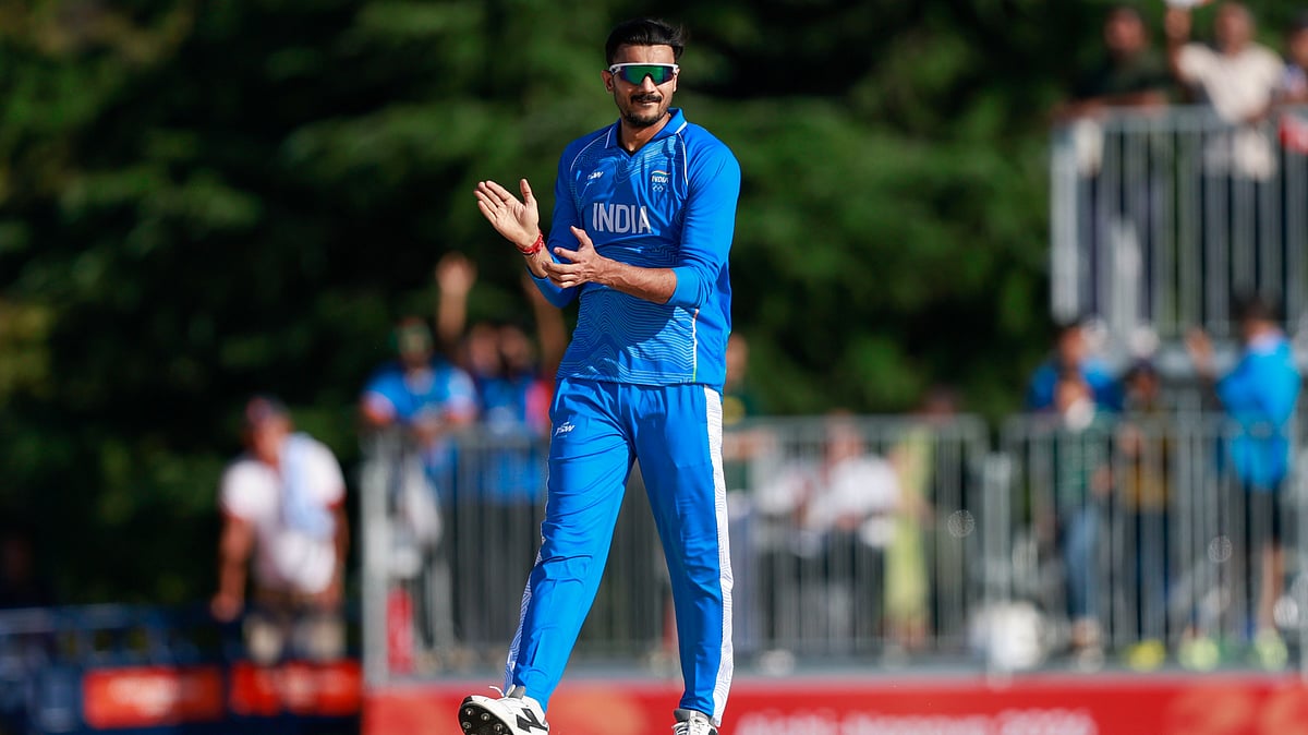 Axar Patel celebrates after scalping two wickets during India vs Sri Lanka Asian Games 2026.  - BCCI/X