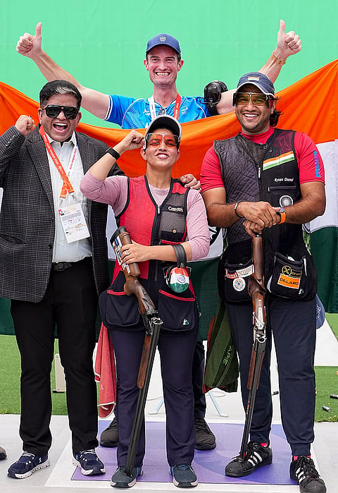 India's Neeru Dhanda and Kynan Chenai celebrate with others after winning gold medal in the trap mixed team shooting event during the 20th Asian Games, in Nagoya, Japan, Wednesday, Sept. 30, 2026. 