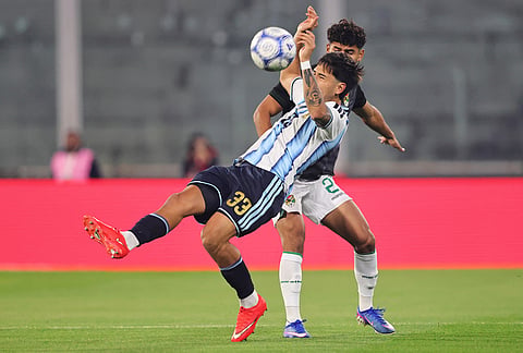 Argentina's Roman Vega, left, and Bolivia's Yomar Rocha battle for the ball during an international friendly soccer match in Cordoba, Argentina, Wednesday, Sept. 30, 2026. 