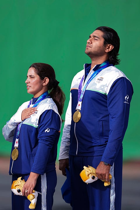 Gold medallist India's Neeru Dhanda, left, and Kynan Chenai during the medal ceremony after the trap mixed team shooting event at the 20th Asian Games, in Nagoya, Japan, Wednesday, Sept. 30, 2026. 