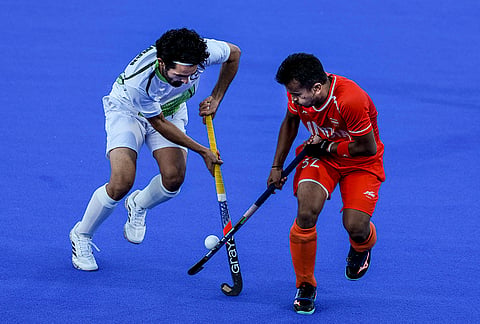 India's Vivek Sagar Prasad, right, jostles for possession of the ball with Pakistan's Rehman Abdul during the men's hockey semi-final match between India and Pakistan at the 20th Asian Games Aichi-Nagoya 2026, in Kakamigahara, Japan, Thursday, Oct. 1, 2026. 