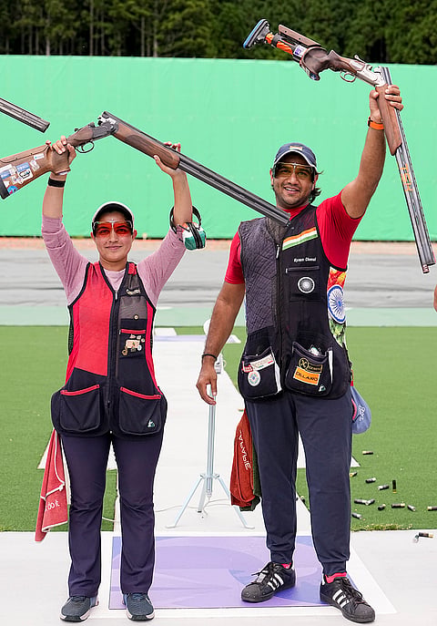 India's Neeru Dhanda, left, and Kynan Chenai celebrate after winning gold medal in the trap mixed team shooting event during the 20th Asian Games, in Nagoya, Japan, Wednesday, Sept. 30, 2026. 