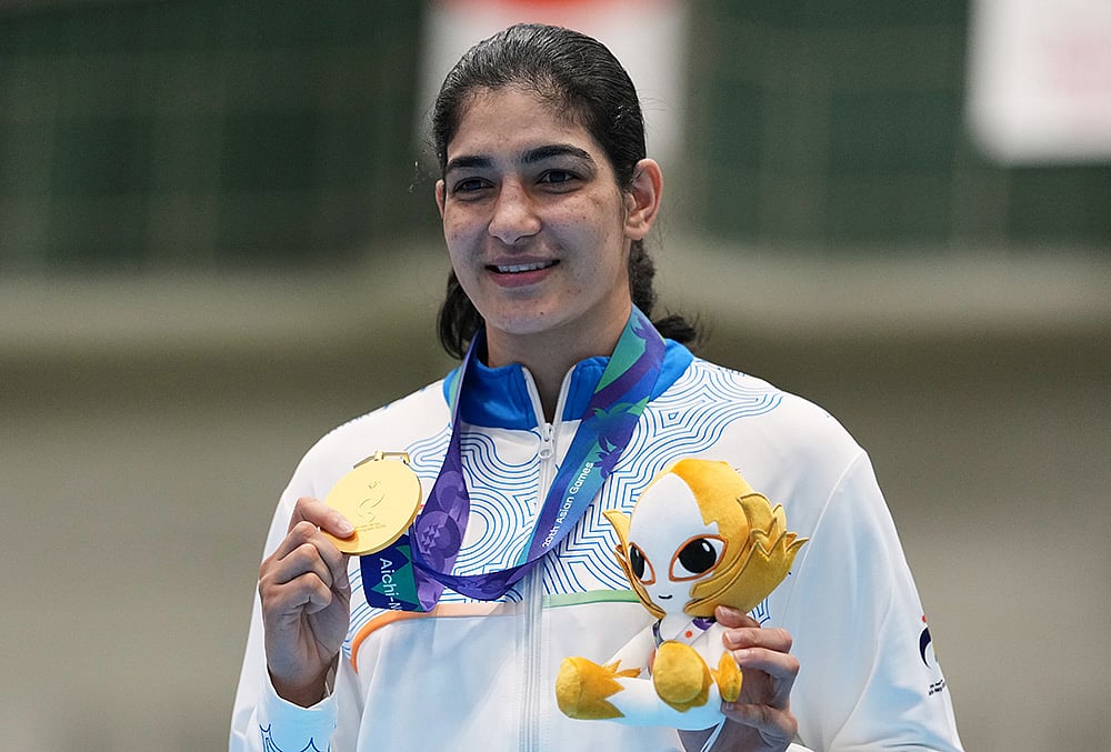 India's Parveen Hooda poses with her gold medal during the medal ceremony for the women's 65kg boxing event at the Asian Games in Nishio, Aichi prefecture, Japan, Friday, Oct. 2, 2026. 
 - | Photo: AP/Lee Jin-man
