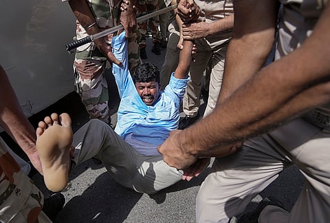 A protestor being detained by the police during an agitation against the CEC near the Jantar Mantar, in New Delhi, Friday, Oct. 2, 2026. 
