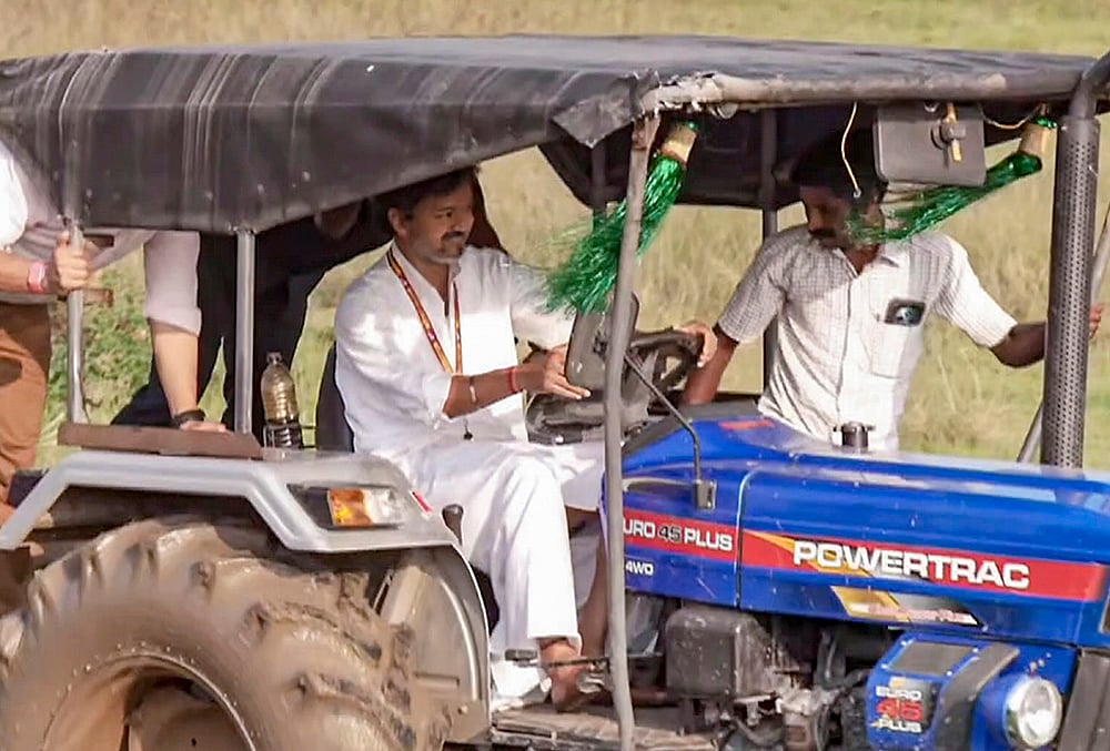 TN CM Vijay drives tractor during political campaign in Chengalpattu