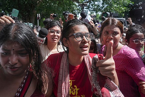 All India Students' Association (AISA) National President Neha Bora being detained during a protest carried out by political parties and members of AISA, SFI, NSUI and other student bodies against Chief Election Commissioner (CEC) Gyanesh Kumar, demanding his resignation over the alleged irregularities in the Special Intensive Revision (SIR) of electoral rolls and mass deletion of voters, at Jantar Mantar, in New Delhi, Friday, Oct. 2, 2026. The Delhi Police detained more than 500 protesters, including AAP leaders, as well as activists of some student outfits, during this protest. 
