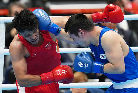 India's Ankush, in red, and South Korea's Kim Min-seong, in blue, fight in their men's 80kg boxing final match at the Asian Games in Nishio, Aichi prefecture, Japan, Friday, Oct. 2, 2026. 