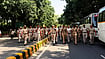  | Mrinalini Dhyani : Delhi Police personnel march down a tree-lined road near Jantar Mantar on Friday, with buses parked alongside to carry away detained protesters.