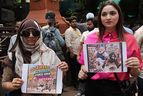 Supporters of the Cockroach Janta Party hold placards as they arrive to take part in a protest against Chief Election Commissioner Gyanesh Kumar and call for the suspension of the Special Intensive Revision (SIR) of electoral rolls in Mumbai, Friday, Oct. 2, 2026.
