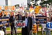 | Photo: AP/Allison Robbert : Sen. Jeff Merkley, D-Ore., speaks to demonstrators at Memorial Circle to protest the proposed Triumphal Arch, Thursday, Oct. 1, 2026, in Arlington, Virginia.
