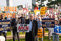 In Photos: US Lawmakers, Veterans Protest Against Trump’s Planned 250-Foot Arch | Photo: AP/Allison Robbert : Sen. Jeff Merkley, D-Ore., speaks to demonstrators at Memorial Circle to protest the proposed Triumphal Arch, Thursday, Oct. 1, 2026, in Arlington, Virginia.
