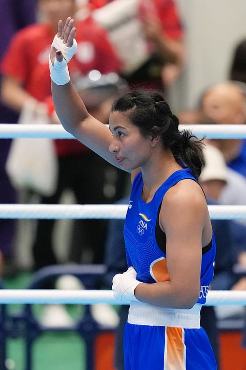 India's Lovlina Borgohain, in blue, celebrates after defeating China's Bao Ziyi, in their women's 75kg boxing final match at the Asian Games in Nishio, Aichi prefecture, Japan, Friday, Oct. 2, 2026.