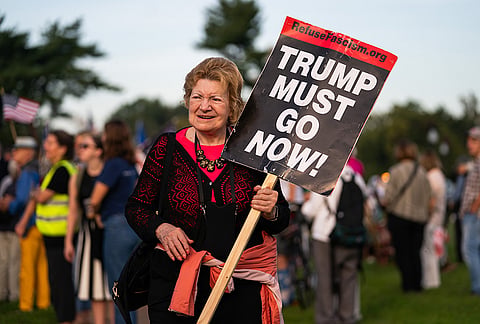 Demonstrators gather at Memorial Circle to protest the proposed Triumphal Arch, Thursday, Oct. 1, 2026, in Arlington, Virginia.
