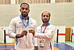 Nitesh Siwach Wins Silver as Yuri Nakazato Denies India Long-Awaited Greco-Roman Asian Games Gold | Photo: PTI : India's Greco-Roman wrestler Nitesh Siwach, left, poses with his silver medal along with national coach Hargobind Singh after winning the medal at the Aichi-Nagoya Asian Games, in Nagoya, Japan. Siwach secures the first silver medal in Greco-Roman wrestling at the Asian Games since 1962.