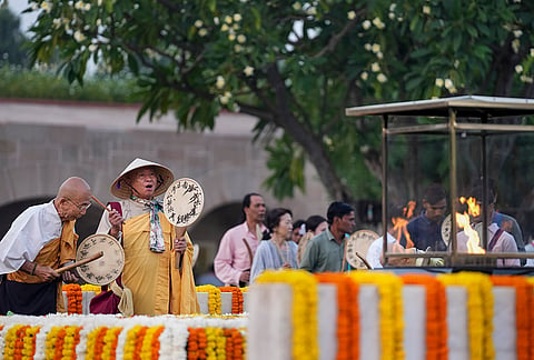 Monks play 'Uchiwa Daiko', a traditional Japanese hand drum, as they pay tribute to Mahatma Gandhi on his 157th birth anniversary, at Raj Ghat, in New Delhi, Friday, Oct. 2, 2026. 

