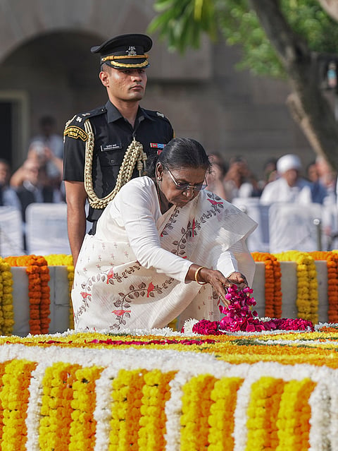 President Droupadi Murmu pays tribute to Mahatma Gandhi on his 157th birth anniversary, at Raj Ghat, in New Delhi.