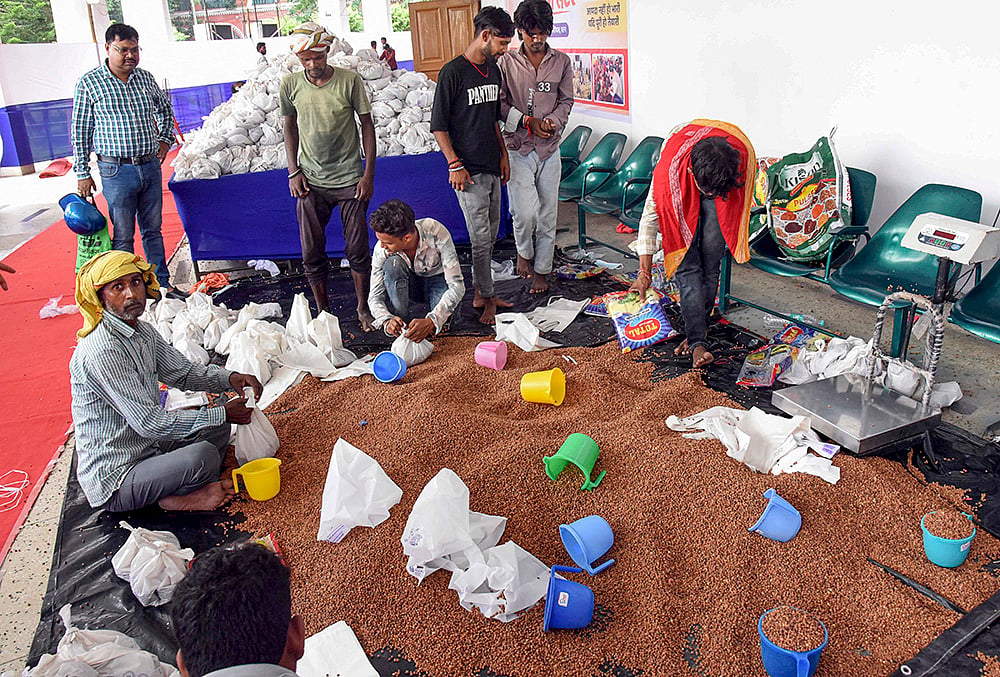 Volunteers pack essential relief supplies for flood-affected families in Patna