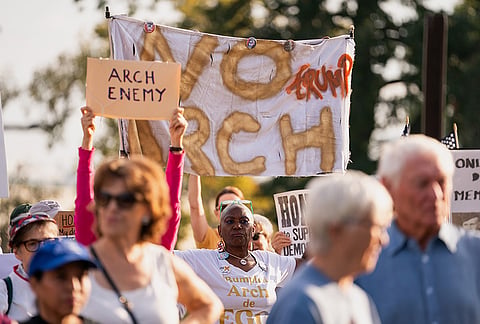Demonstrators gather at Memorial Circle to protest the proposed Triumphal Arch, Thursday, Oct. 1, 2026, in Arlington, Virginia.
