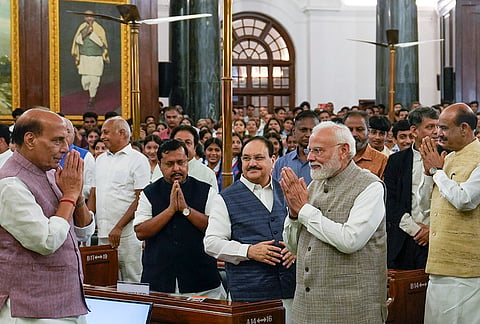 Prime Minister Narendra Modi exchanges greetings with Union Defence Minister Rajnath Singh as Lok Sabha Speaker Om Birla, BJP National President and MP Nitin Nabin and Union Minister JP Nadda look on during a tribute paying ceremony to Mahatma Gandhi and former prime minister Lal Bahadur Shastri on their birth anniversaries, at the Central Hall of Samvidhan Sadan, in New Delhi, Friday, Oct. 2, 2026. 
