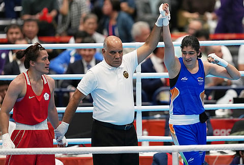 India's Parveen, in blue, celebrates her win by decision over Taiwan's Chen Nien-chin, in red, in their women's 65kg boxing final match at the Asian Games in Nishio, Aichi prefecture, Japan, Friday, Oct. 2, 2026. 
