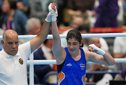 India's Parveen, in blue, celebrates her win by decision over Taiwan's Chen Nien-chin, in their women's 65kg boxing final match at the Asian Games in Nishio, Aichi prefecture, Japan, Friday, Oct. 2, 2026. 
