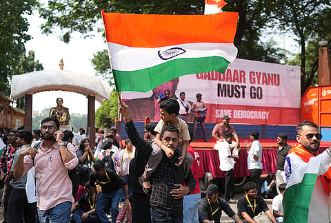 A supporter of the Cockroach Janta Party waves national flag as he takes part in a protest against Chief Election Commissioner Gyanesh Kumar and call for the suspension of the Special Intensive Revision (SIR) of electoral rolls in Mumbai, Friday, Oct. 2, 2026. 
