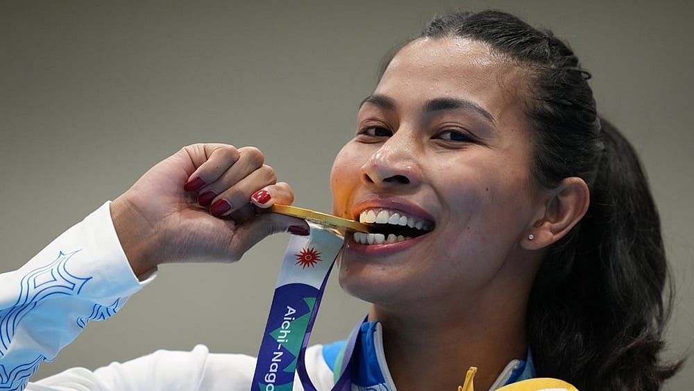 India's Lovlina Borgohain poses with her gold medal during the medal ceremony for the women's 75kg boxing final match at the Asian Games in Nishio, Aichi prefecture, Japan, Friday, Oct. 2, 2026.  - | Photo: AP/Lee Jin-man