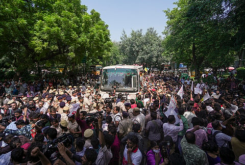 Police personnel detain people protesting against the CEC near the Jantar Mantar, in New Delhi, Friday, Oct. 2, 2026. 
