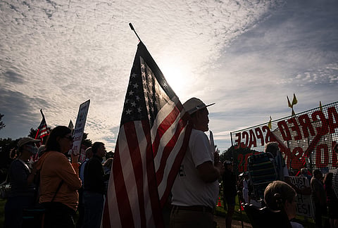 Demonstrators gather at Memorial Circle to protest the proposed Triumphal Arch, Thursday, Oct. 1, 2026, in Arlington, Virginia.
