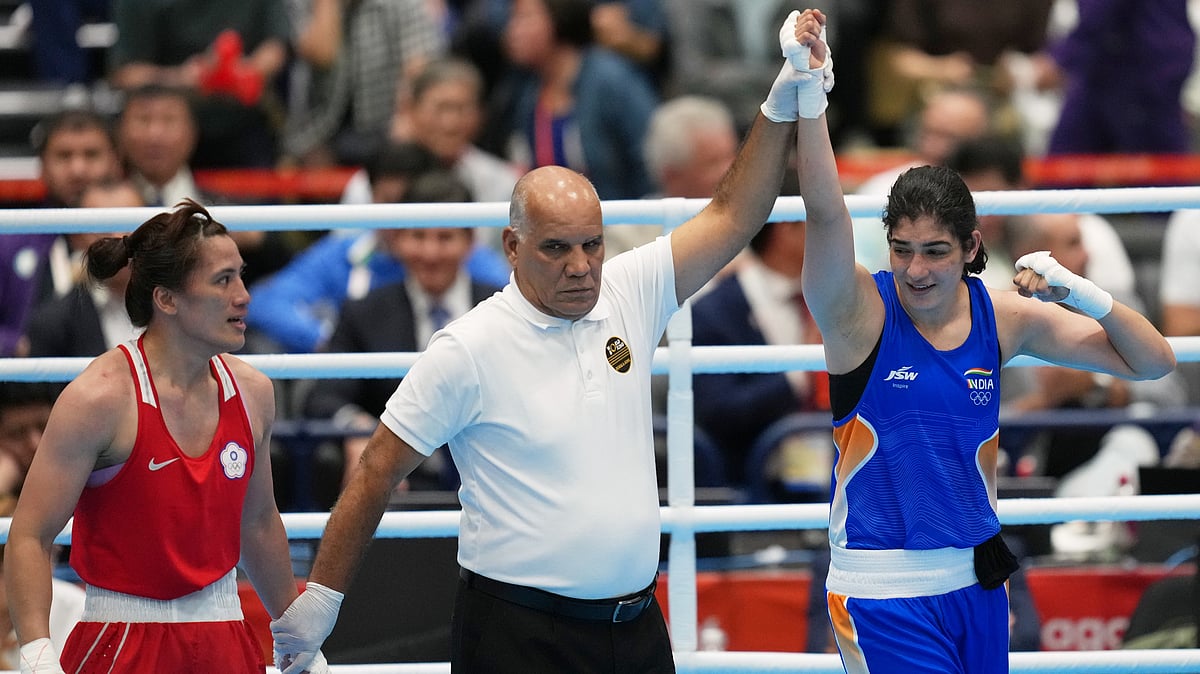 India's Parveen, in blue, celebrates her win by decision over Taiwan's Chen Nien-chin, in red, in their women's 65kg boxing final match at the Asian Games in Nishio, Aichi prefecture, Japan, Friday, Oct. 2, 2026. - (AP Photo/Lee Jin-man)