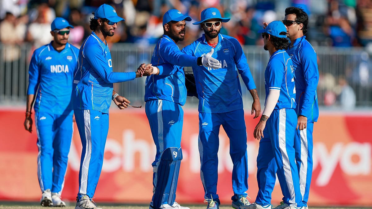 Indian cricketers celebrate a wicket during Asian Games 2026 semi-final against Sri Lanka.  - BCCI/X