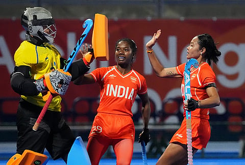 India's goal keeper Savita, left, celebrates after saving a goal after team china player attack during the women's hockey gold medal match at the Asian Games in Gifu, Japan, Friday, Oct. 2, 2026.
