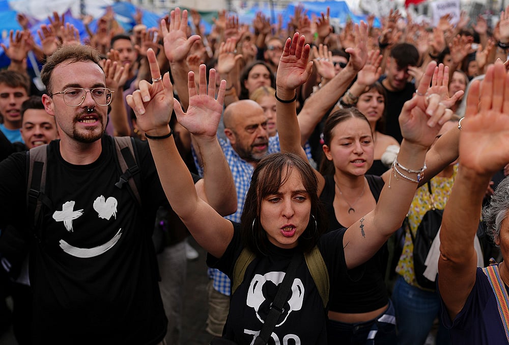 Activists protest near the Spanish Parliament following the eviction of 87-year-old Maria del Carmen Abascal to demand stronger laws to protect renters in Madrid, Spain, Friday, Oct. 2, 2026. 
 - | Photo: AP/Manu Fernandez