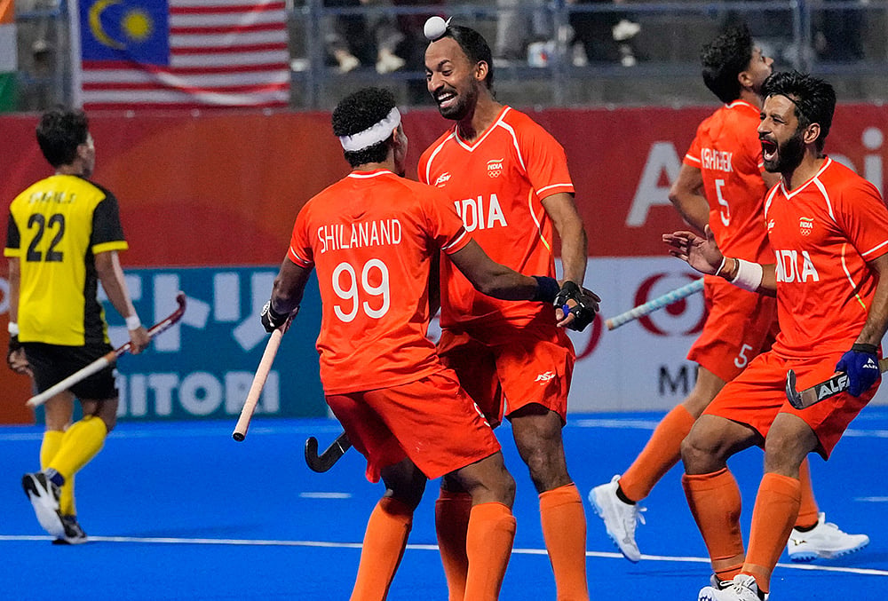 Indias players celebrate their goal pianist Malaysia during the mens hockey final match at the Asian Games in Gifu, Japan, Saturday, Oct. 3, 2026. 