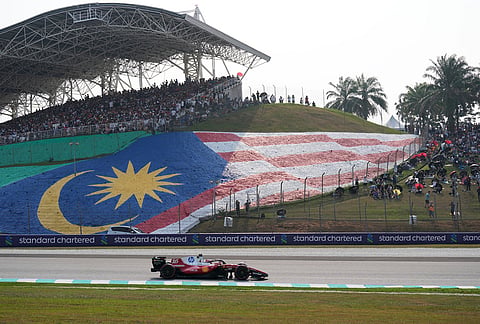 Ferrari driver Charles Leclerc of Monaco steers his car during the qualifying session ahead of the Bahrain Grand Prix in Sepang, Malaysia, Saturday, Oct. 3, 2026. 