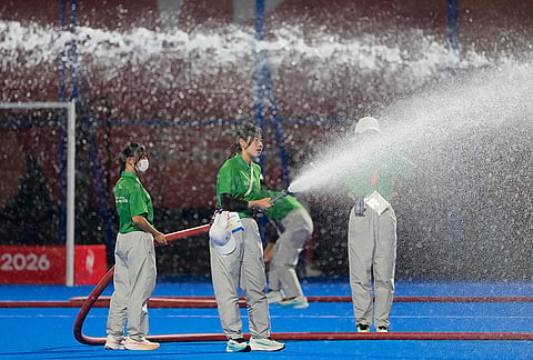 Staff water the pitch during the half time of the men's hockey final match between India and Malaysia at the Asian Games in Gifu, Japan, Saturday, Oct. 3, 2026. 
