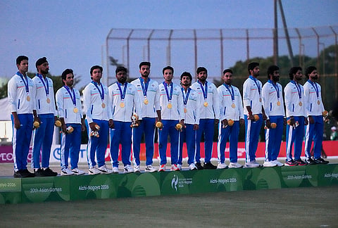 Gold medalists India team members pose on the podium during the medal ceremony for cricket at the Asian Games in Nagoya, Japan, Saturday, Oct. 3, 2026. 
