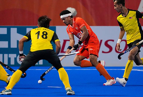 India's Shilanand Lakra andMalaysia's Faiz Jali compete for the ball during the men's hockey final match at the Asian Games in Gifu, Japan, Saturday, Oct. 3, 2026. 