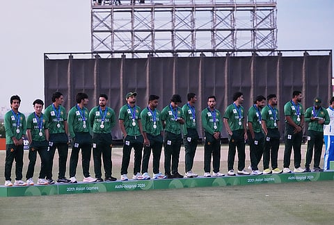 Silver medalists Pakistan team members pose on the podium during the medal ceremony for cricket at the Asian Games in Nagoya, Japan, Saturday, Oct. 3, 2026. 
