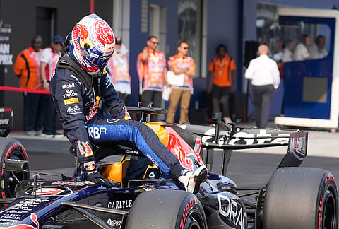 Red Bull driver Max Verstappen of the Netherlands celebrates after setting the pole position during the qualifying session ahead of the Bahrain Grand Prix in Sepang, Malaysia, Saturday, Oct. 3, 2026. 
