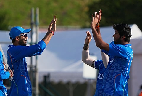 India's Washington Sundar, left, Axar Patel, left, celebrate the wicket of Pakistan's Sahibzada Farhan during the gold medal cricket match between India and Pakistan at the Asian Games in Nagoya, Japan, Saturday, Oct. 3, 2026. 
