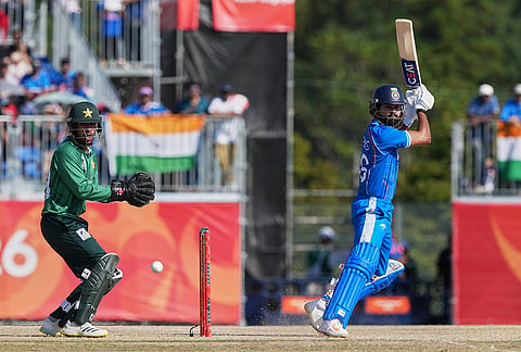 India's Shreyas Iyer, right, hits a shot as Pakistan's Usman Khan, watches during the gold medal cricket match between India and Pakistan at the Asian Games in Nagoya, Japan, Saturday, Oct. 3, 2026. 