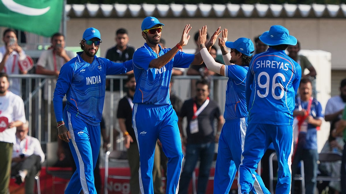 India's Washington Sundar celebrates with team after taking a catch to dismiss Pakistan's Maaz Sadaqat during the gold medal cricket match between India and Pakistan at the Asian Games in Nagoya, Japan, Saturday, Oct. 3, 2026. - (AP Photo/Mark Baker)