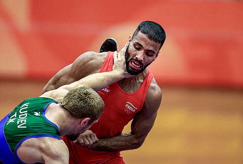 India's Sujeet Kalkal, right, competes in the men's Freestyle 65 kilogram final bout 196 wrestling match against Tajikistan's Abdulmazhid Kudiev in the ongoing Asian Games 2026, in Nagoya, Japan, Friday, Oct. 2, 2026.
