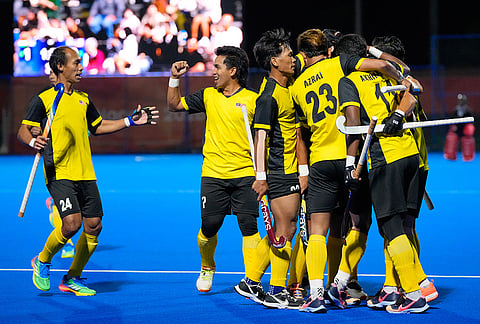 Malaysia's players celebrate after scoring a goal against India during the men's hockey final match at the Asian Games in Gifu, Japan, Saturday, Oct. 3, 2026.
