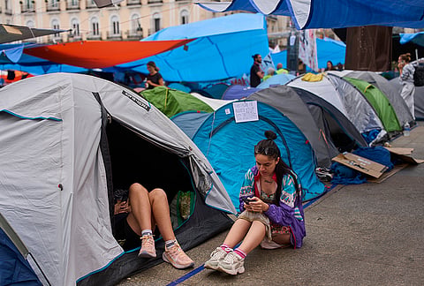 Activists camp during a protest following the eviction last Wednesday of 87-year-old Maricarmen to demand stronger laws to protect renters at Sol square in Madrid, Spain, Wednesday, Sept. 30, 2026. 
